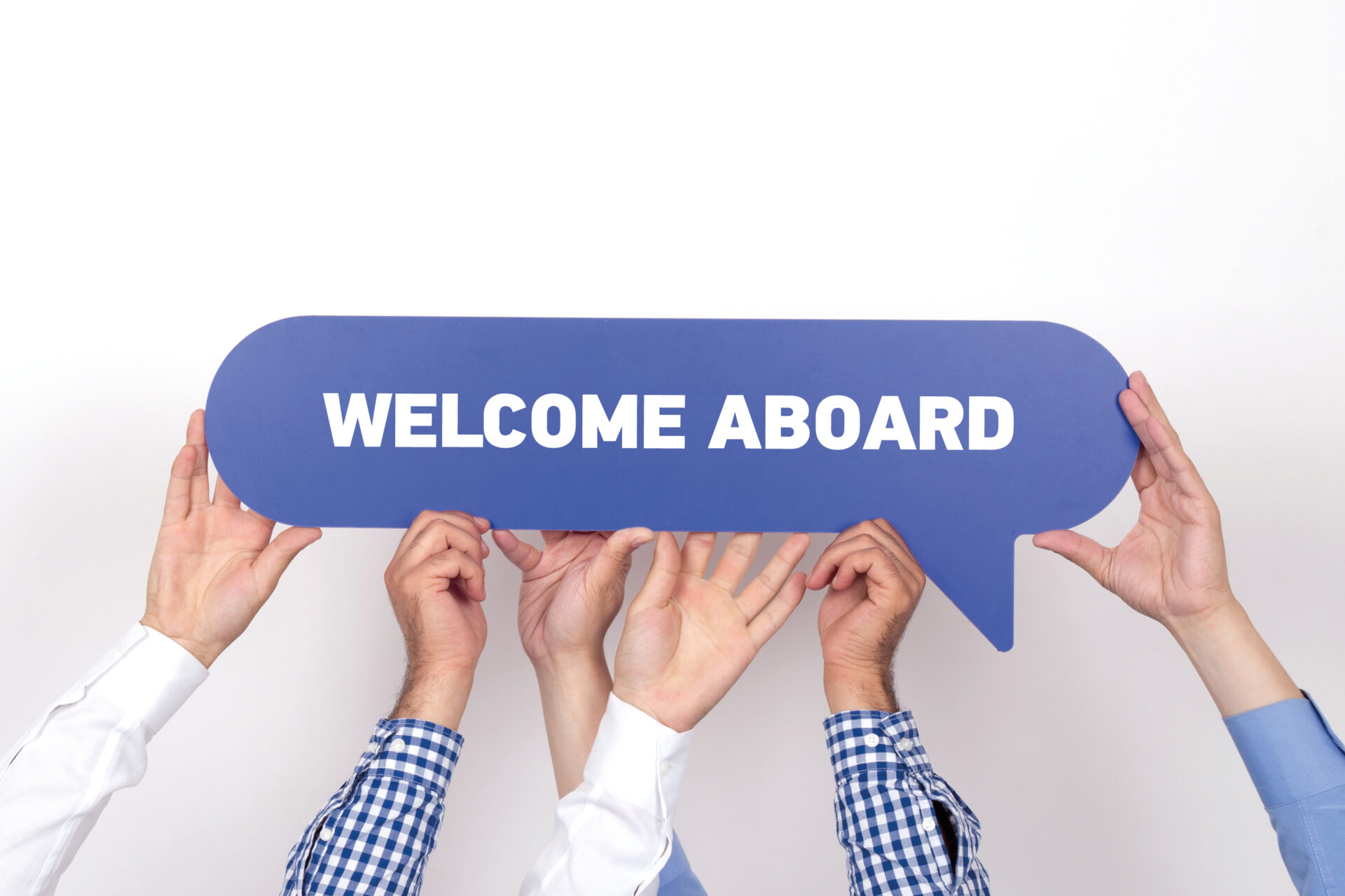 Group of people holding the WELCOME ABOARD written speech bubble